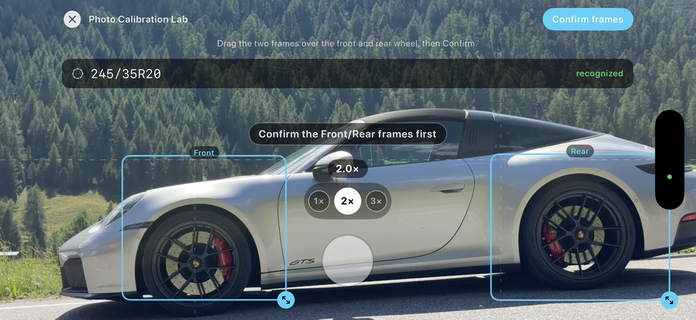 The Photo Calibration Lab in the app: two draggable frames placed over the front and rear wheel of a photographed car, with the tyre size read out and marked recognized